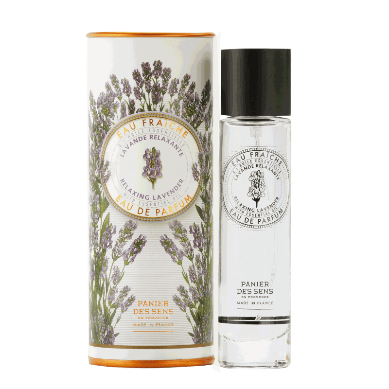 A cylindrical Panier Des Sens lavender box and a clear glass Panier Des Sens Lavender Eau de Parfum bottle with "relaxing lavender perfume" labeled on both. The design features lavender illustrations.