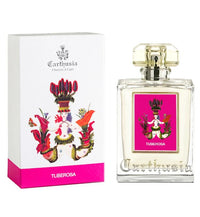 A perfume bottle and packaging of Carthusia I Profumi de Capri's "Carthusia Tuberosa Eau de Parfum - 100ml." The box is white with colorful floral graphics and a pink bottom, while the bottle has a clear square design with a similar.