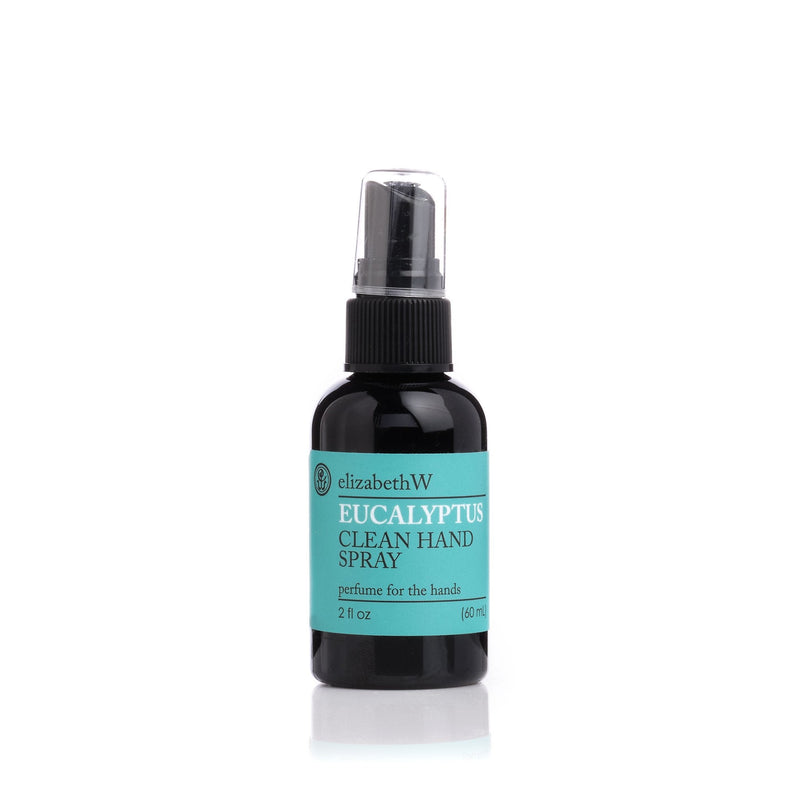 A small travel size bottle of Elizabeth W Botanical Beauty Eucalyptus Clean Hand Spray on a white background. The container is dark with light blue and green labels.
