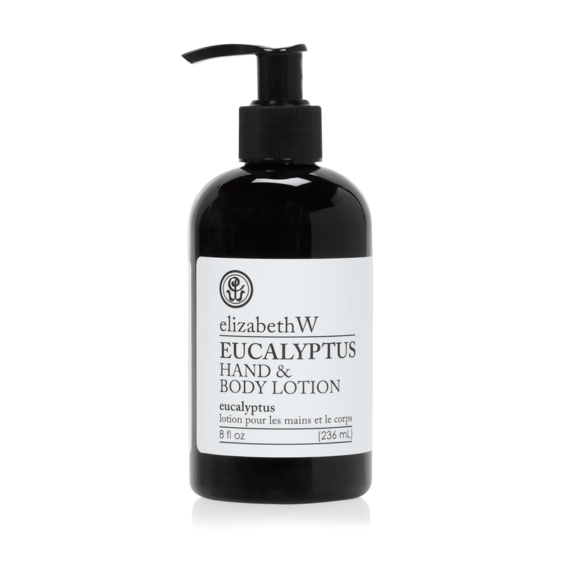 A black bottle of elizabeth W Purely Essential Eucalyptus Hand & Body Lotion with a pump dispenser, isolated on a white background. The label shows the product name and volume of 236 ml.