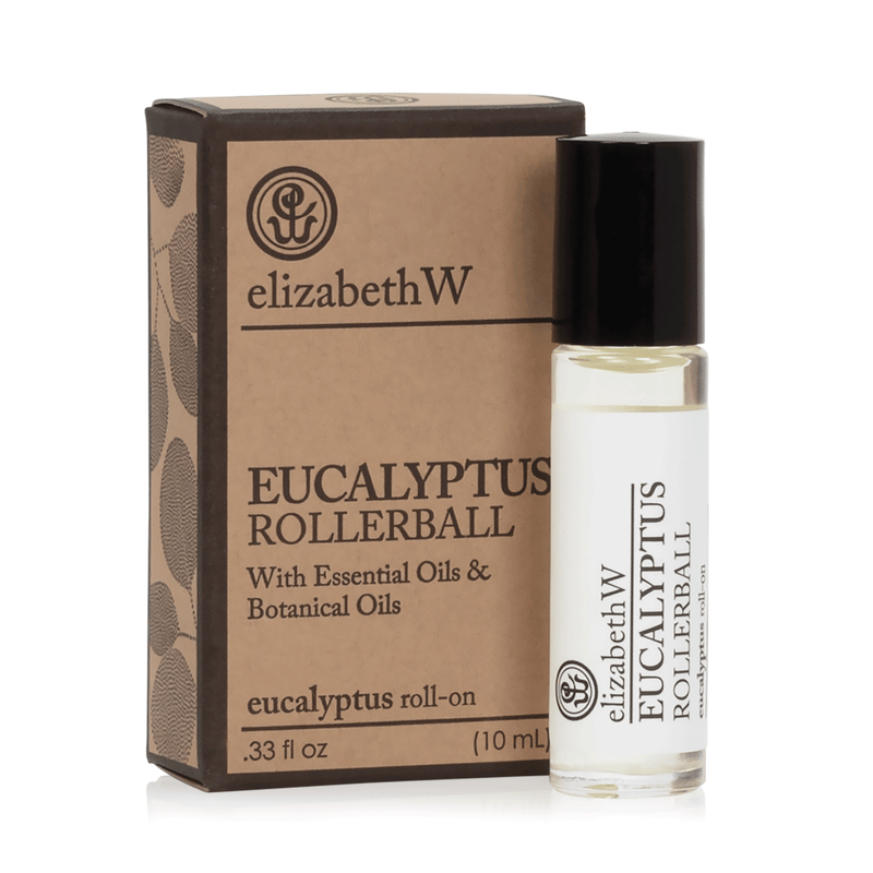 A 10 ml bottle of elizabeth W Purely Essential Eucalyptus Perfume Oil Rollerball with eucalyptus essential oil beside its packaging box. Both the bottle and box feature simple, elegant branding.