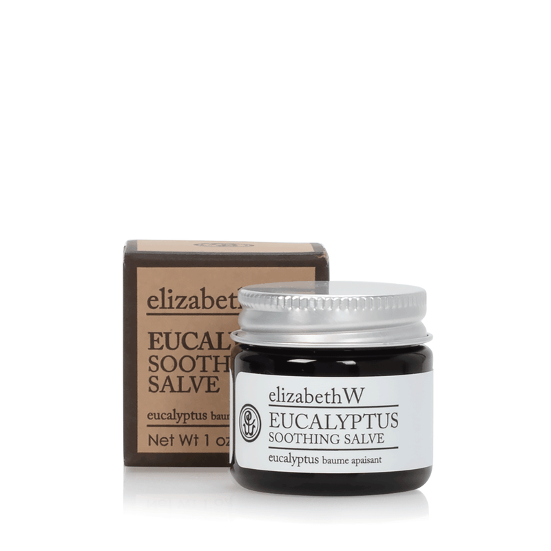 A small jar of elizabeth W Purely Essential Eucalyptus Soothing Salve with shea butter, accompanied by its packaging box. The jar is transparent with a white lid and labeled clearly in front.