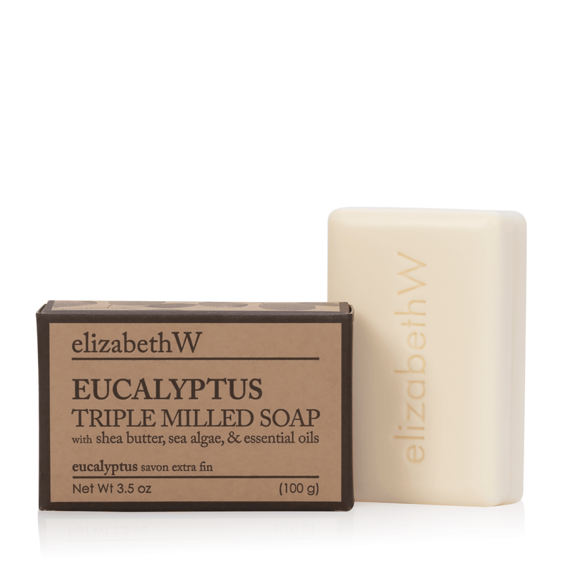 A bar of elizabeth W Purely Essential Eucalyptus Triple-Milled Soap next to its packaging. The box is labeled "elizabeth W eucalyptus soap triple-milled, sea algae, & essential oils," indicating