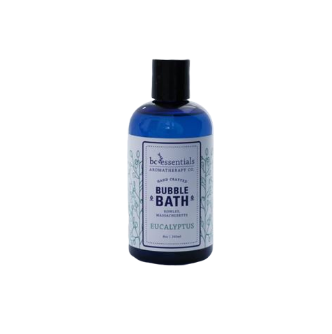A blue bottle of BC Essentials - Eucalyptus Bubble Bath, formulated with pure essential oils and labeled with intricate green floral designs, displayed against a plain white background.