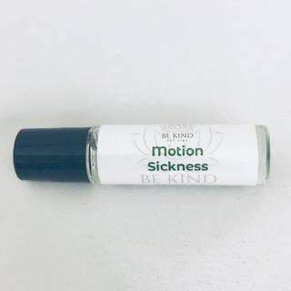 A tube labeled "Be Kind Pet Line - Motion Sickness" with a navy blue cap, designed to calm pet stomach during travel, placed against a plain white background.