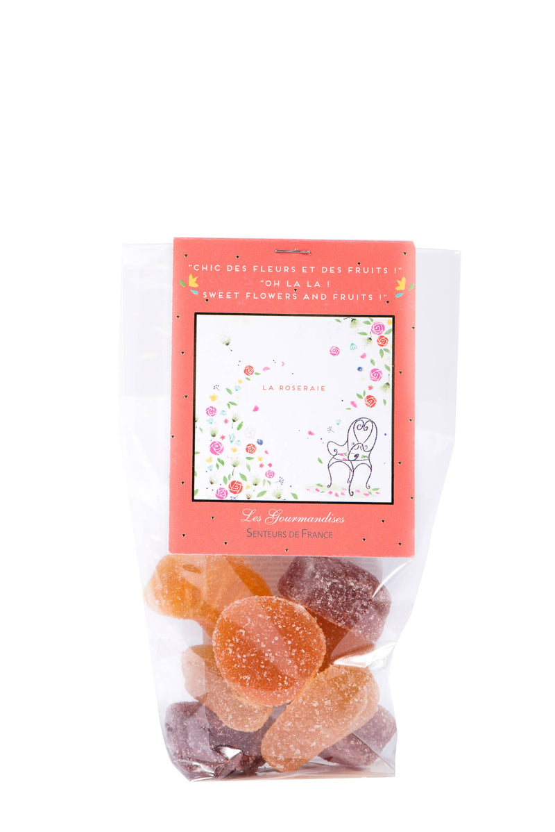 A package of Senteurs de France Rose Garden Fruit Paste Candies. Its translucent front displays orange and pink sugar-coated candies, with a decorative pink label featuring Roseraie designs.