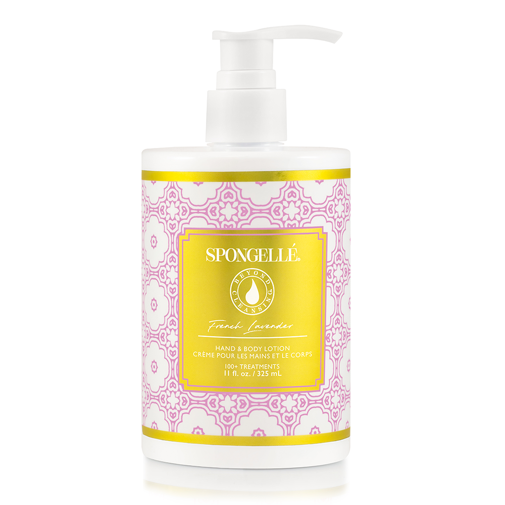 A pump bottle of Spongellé - French Lavender Body lotion, featuring bright pink and yellow packaging with ornate geometric patterns. This shea butter lotion is ideal for dry skin.