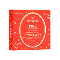 A bright orange box labeled "Spongellé - Zodiac Collection - Fire, Spiced Neroli" with zodiac symbols for Aries, Leo, and Sagittarius, indicating a body