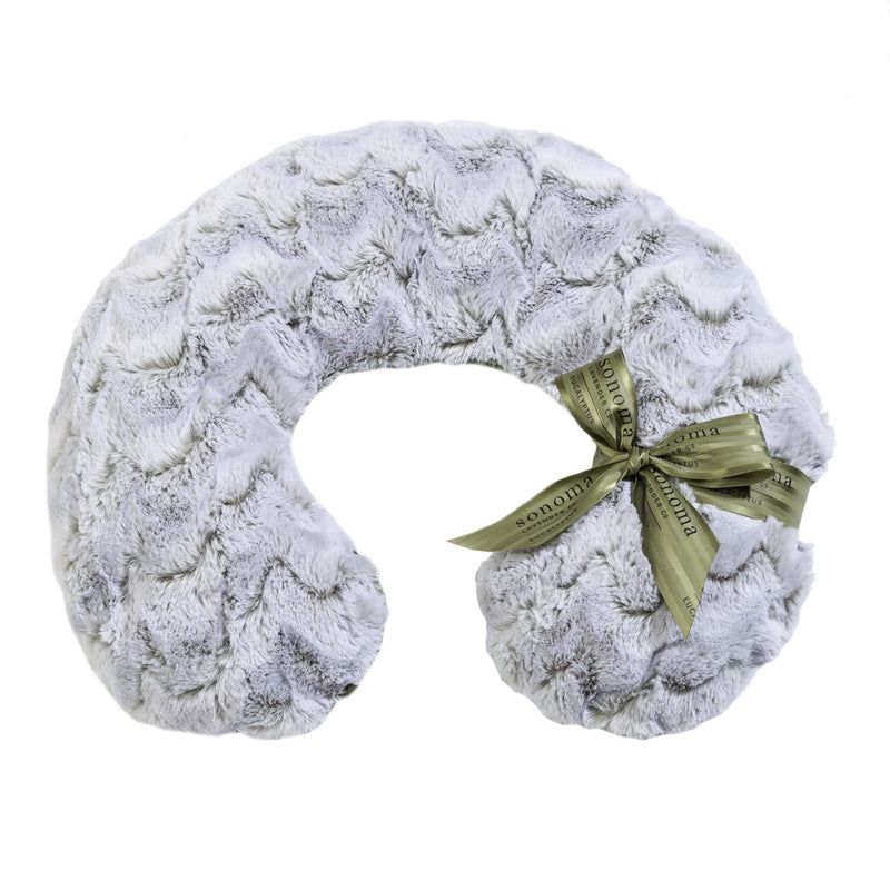 A plush gray Sonoma Lavender neck pillow shaped like a horseshoe, accented with a decorative green ribbon and the brand tag "Sonoma" displayed prominently, featuring cold-water washable flaxseed-filled inserts.