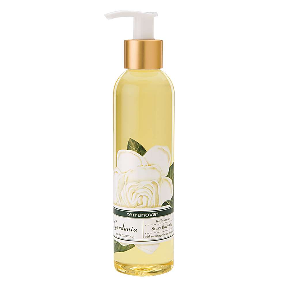 A bottle of Terra Nova Gardenia Silky Body Oil with a pump dispenser. The label features a white gardenia flower illustration and the container is filled with a yellow liquid.