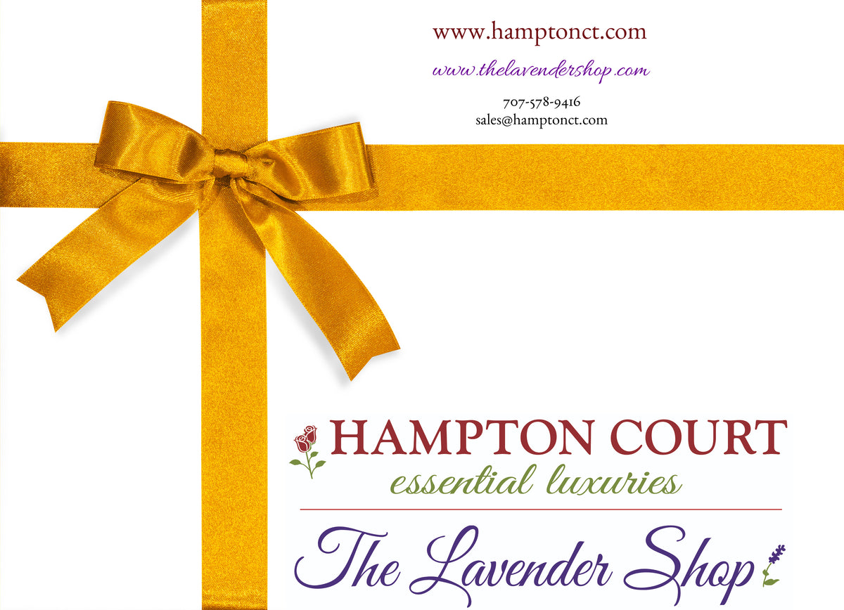Promotional image featuring a gold ribbon forming a cross on a white background, with text advertising "Hampton Court Essential Luxuries The Lavender Shop." Includes information about Hampton Court Essential Luxuries Online Gift Cards and how to redeem them.