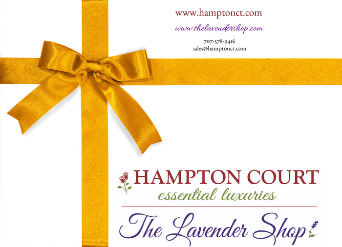 Promotional image featuring a gold ribbon forming a cross on a white background, with text advertising "Hampton Court Essential Luxuries The Lavender Shop." Includes information about Hampton Court Essential Luxuries Online Gift Cards and how to redeem them.
