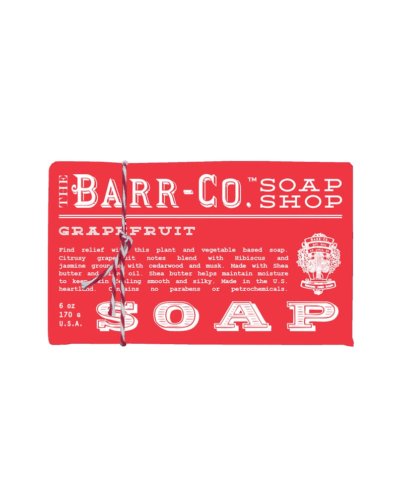 A red soap packaging label for Barr-Co. featuring text about product details such as ingredients and manufacturing location, adorned with vintage decorative elements, now highlighting its unique grapefruit hib