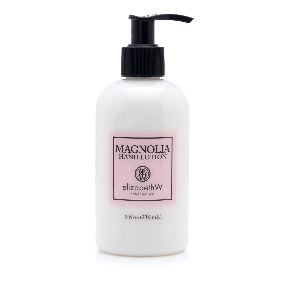 A bottle of white elizabeth W Signature Magnolia Hand Lotion, featuring a simple design with a pink label, a pump dispenser, and an 8 fl oz volume, isolated on a white background.