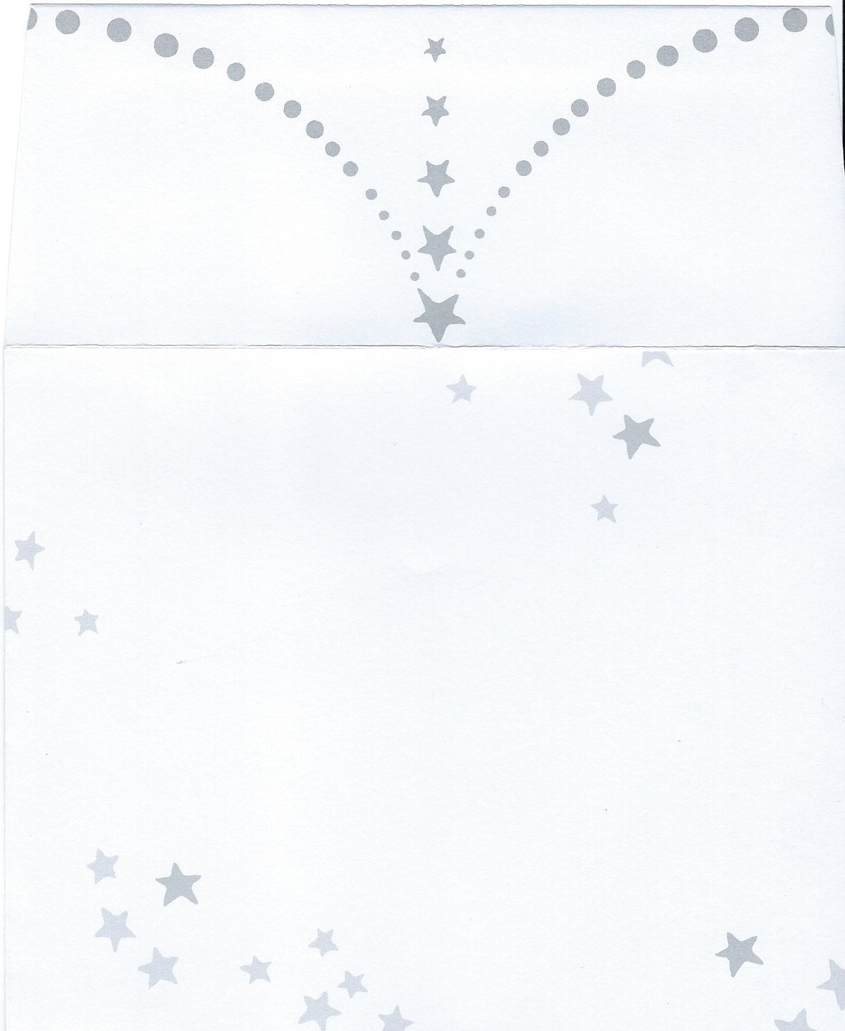 Scan of a white decorative envelope with a pattern consisting of gray dots and stars arranged in arched lines and scattered randomly across the page by Greeting Cards' Birthday Greeting Card - A Happy Birthday.
