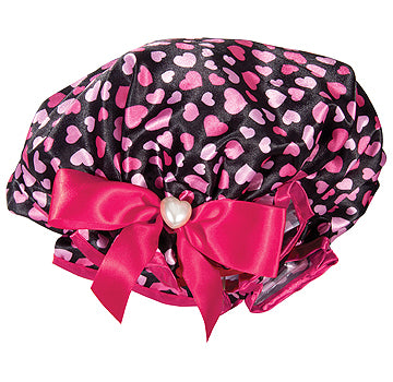 A pink and black Fancy Shower Cap decorated with multiple pink hearts, accented with a glossy satin bow and a heart-shaped pearl at the center by Shower Caps.