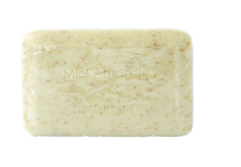 A rectangular bar of La Lavande Honey Almond 250gm natural shea butter soap with speckled texture, labeled "miel amande" and "made in France", isolated on a white background.