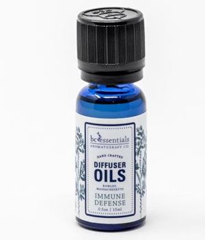 A small blue bottle labeled "BC Essentials - Diffuser Oil - Immune Defense" with a black cap on a white background.