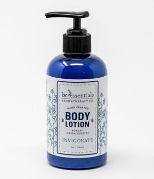 A blue bottle of BC Essentials - Invigorate Body Lotion - 8oz handcrafted body lotion made with pure essential oils, features a pump dispenser against a white background.