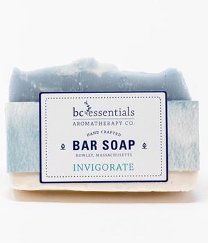 A stack of two BC Essentials - Invigorate Bar Soaps, labeled "bc essentials aromatherapy co. invigorate, Rowley, Massachusetts," against a white background. These soaps, made with essential oils.