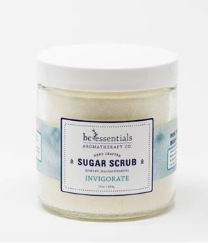 A glass jar of BC Essentials - Invigorate Sugar Scrub - 16oz with Eucalyptus Essential Oil, labeled "invigorate" against a plain white background. The label features a clean, minimalist design.