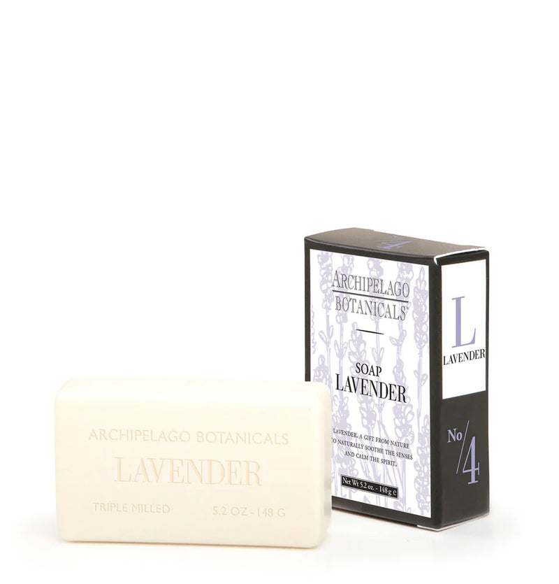 A bar of Archipelago Botanicals Lavender All Natural Bar Soap next to its packaging box, which is decorated with elegant grey and black designs.