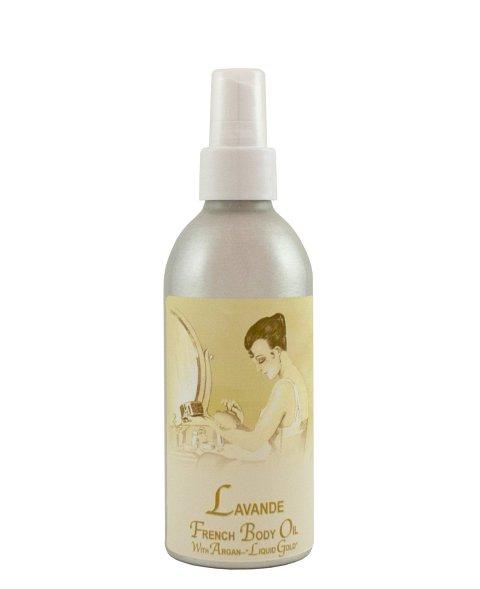 A silver spray bottle labeled "La Bouquetiere Lavender French Argan Body Oil" featuring a vintage-style illustration of a woman grooming at a vanity table.