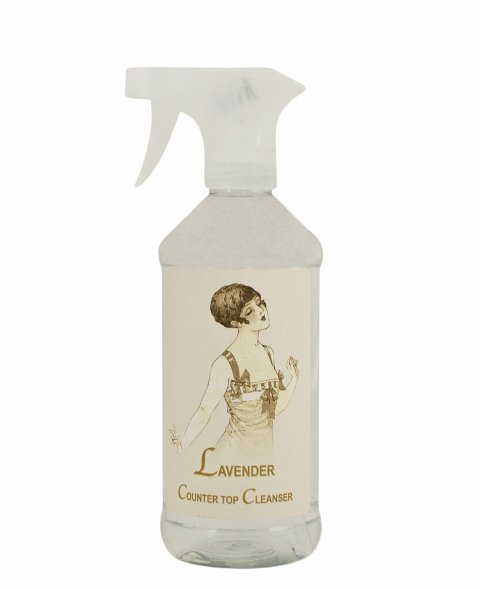 A spray bottle of La Bouquetiere Lavender Counter Spray, a lavender-scented all-purpose cleanser with a vintage illustration of a woman on the label, isolated on a white background.