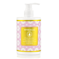 A Spongellé French Lavender Body Lotion bottle with a pump dispenser, featuring a vibrant yellow and pink Moroccan-inspired design.