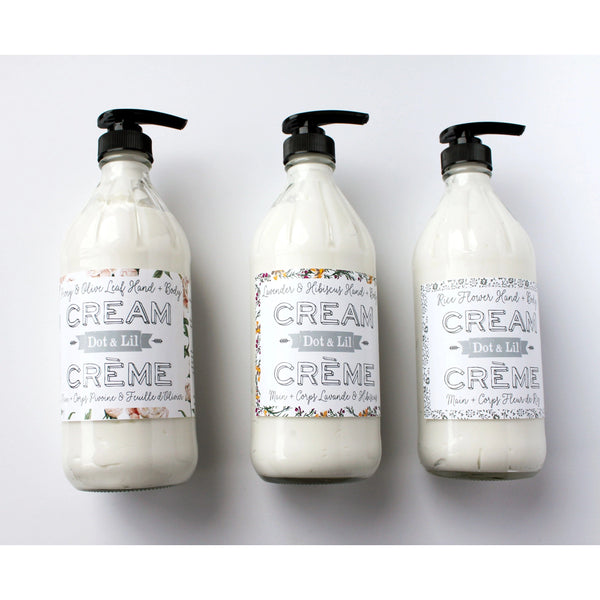 Three identical Dot & Lil Lavender & Hibiscus Hand & Body Cream bottles with ornate script labels reading "cream do it all" and pump tops, arranged in a row on a light background. Each bottle contains essential oil Lavender for enhanced benefits.