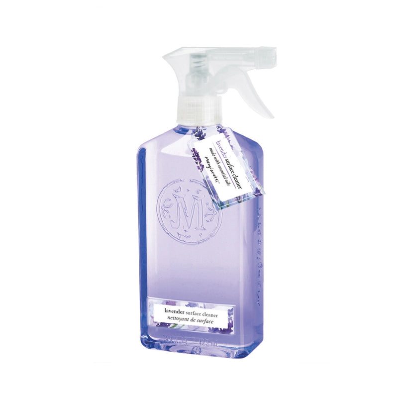 Transparent spray bottle with Mangiacotti Lavender Surface Cleaner and a label featuring elegant script and a circular emblem, tied with a small white tag.