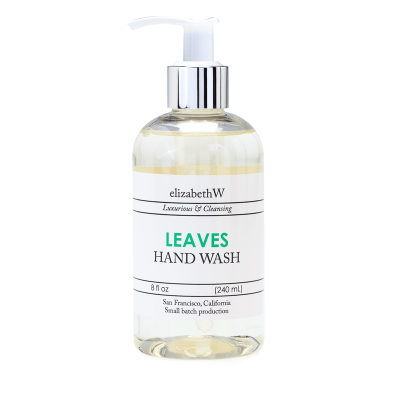 Clear bottle of elizabeth W Small Batch Apothecary Leaves Hand Wash with a pump dispenser, labeled "leaves hand cream, luxurious & cleansing, 8 oz, San Francisco, California" on a white background.