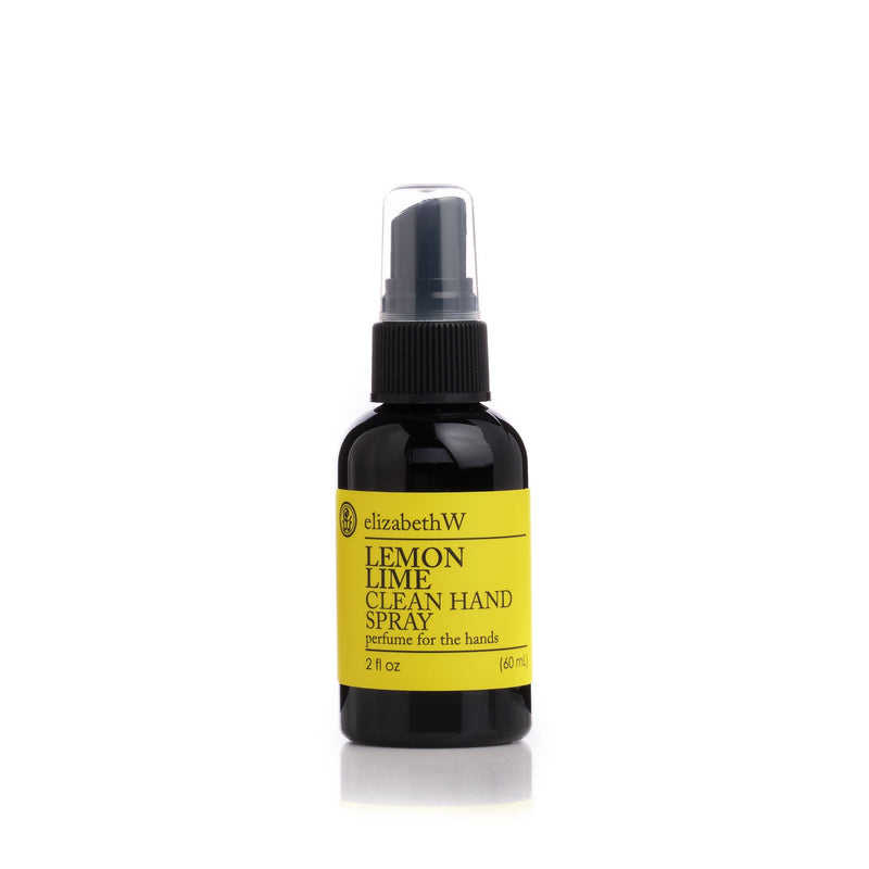 A bottle of elizabeth W Botanical Beauty Lemon Lime Clean Hand Spray, a perfume for the hands enriched with essential oils, against a white background. It features a black label with yellow and white text.