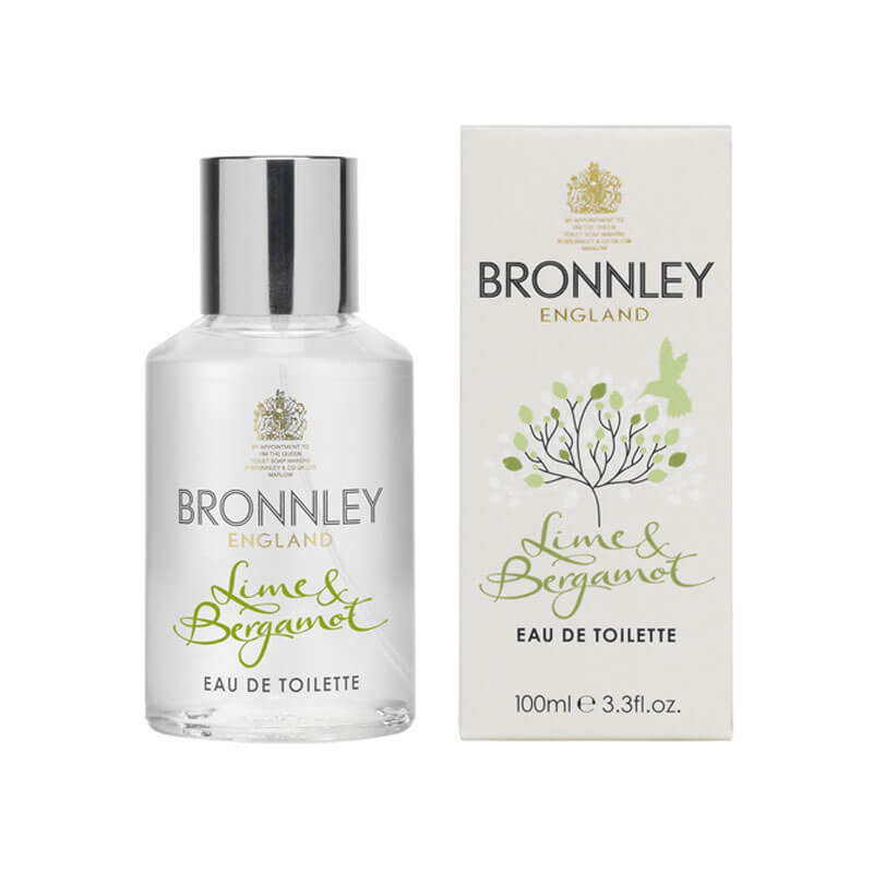 A bottle of Bronnley English Soaps Lime & Bergamot Eau Fraiche next to its packaging. The bottle and box are labeled with elegant green plant motifs and display the product details.