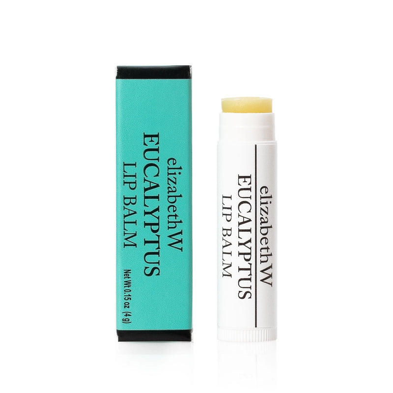 Elizabeth W Botanical Apothecary Eucalyptus Shea Butter Lip Balm in a teal and black packaging, displayed next to an open tube with the cap off, isolated on a white background.