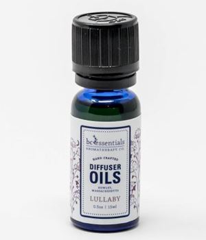 A small bottle of "BC Essentials - Diffuser Oil - Lullaby" containing 15 ml of lavender & mandarin essential oils. The bottle is dark blue with BC Essentials labeling.