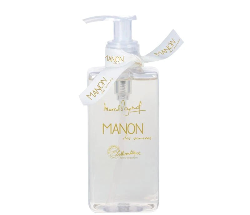 Lothantique liquid soap dispenser with a white pump, adorned with a ribbon. Labeled "Lothantique Manon des Sources" in elegant, gold script on the front.