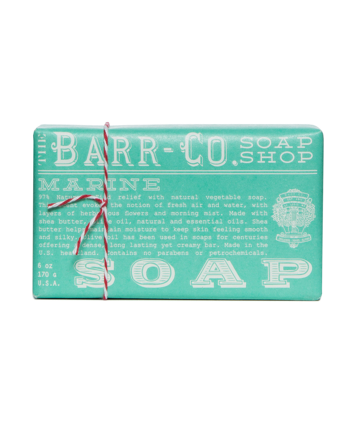 A Barr-Co. Marine Triple Milled Bar Soap wrapped in paper packaging with white text detailing the product's natural ingredients and a red and white string tied around it.