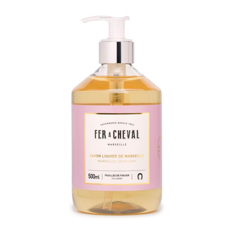 A clear pump bottle containing 500ml of Fer à Cheval Marseille Liquid Soap Fig Leaves, labeled in pink and white with French text, isolated on a white background.
