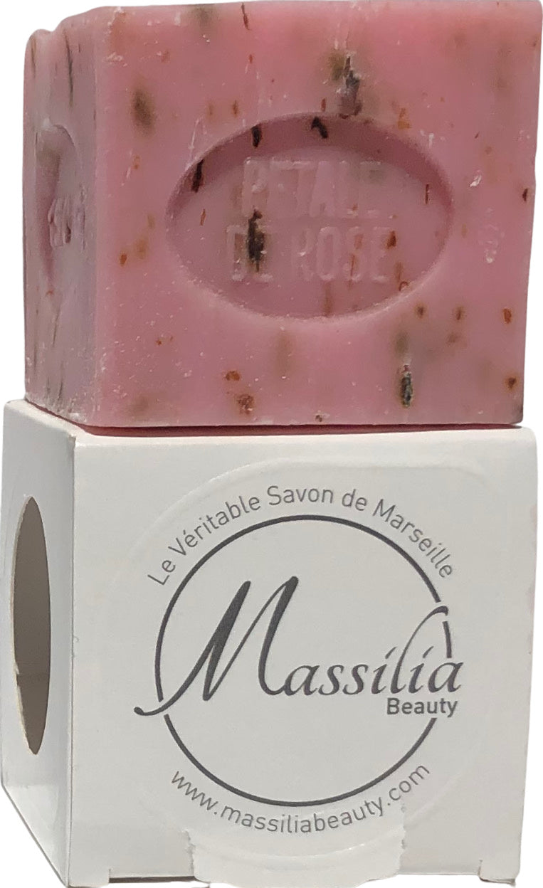 Bar of pink Massalia Beauty 150gr Rose Petal Cube Soap with visible botanical inclusions, resting on its labeled white box with black text "le véritable savon de Marseille Made in Provence workshop".