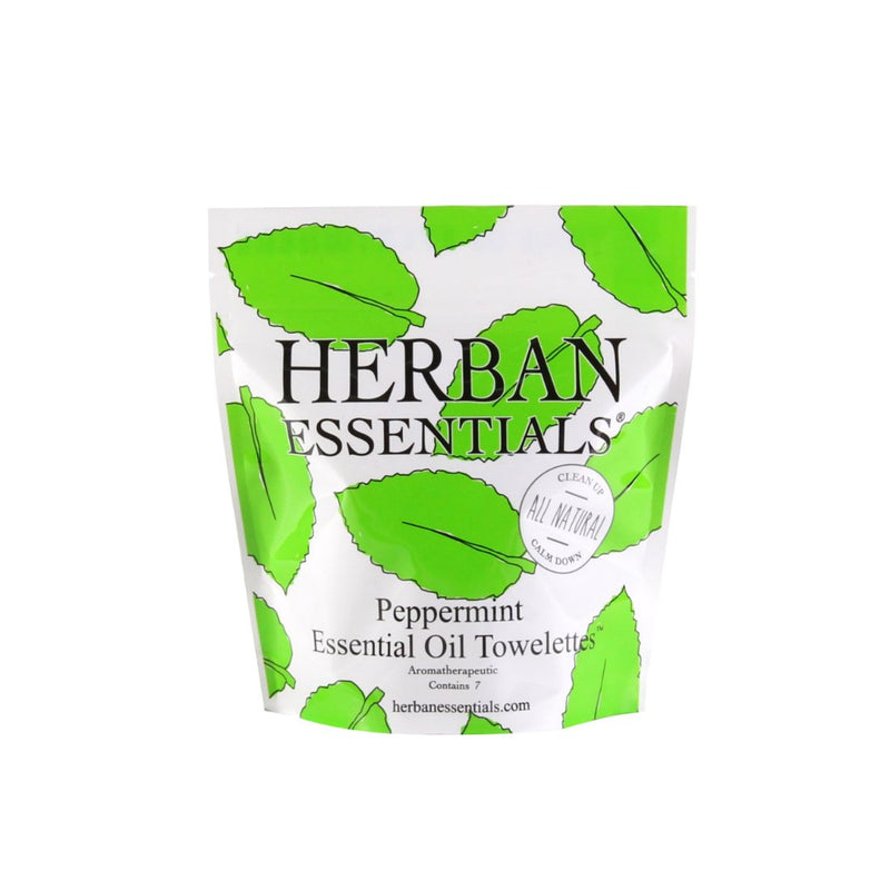 Package of Herban Essentials Essential Oil Towelettes - Peppermint Mini-Bags, featuring vibrant green leaves design and text emphasizing its naturally uplifting and cruelty-free.