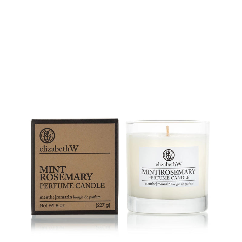 A elizabeth W Purely Essential Mint Rosemary Candle, displayed next to its brown packaging box. The glass container is labeled clearly and holds the white soy candle with a single wick.