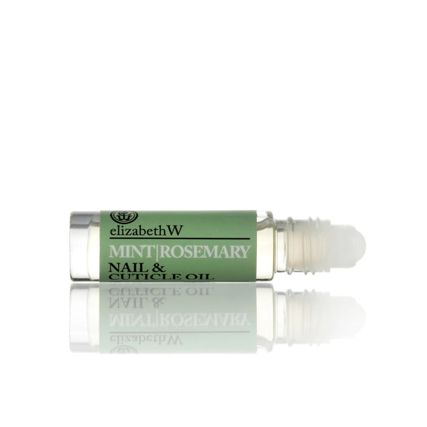 A green and white elizabeth W Botanical Apothecary Mint & Rosemary Nail & Cuticle Oil rollerball bottle, displayed upright with a reflection on a white surface.