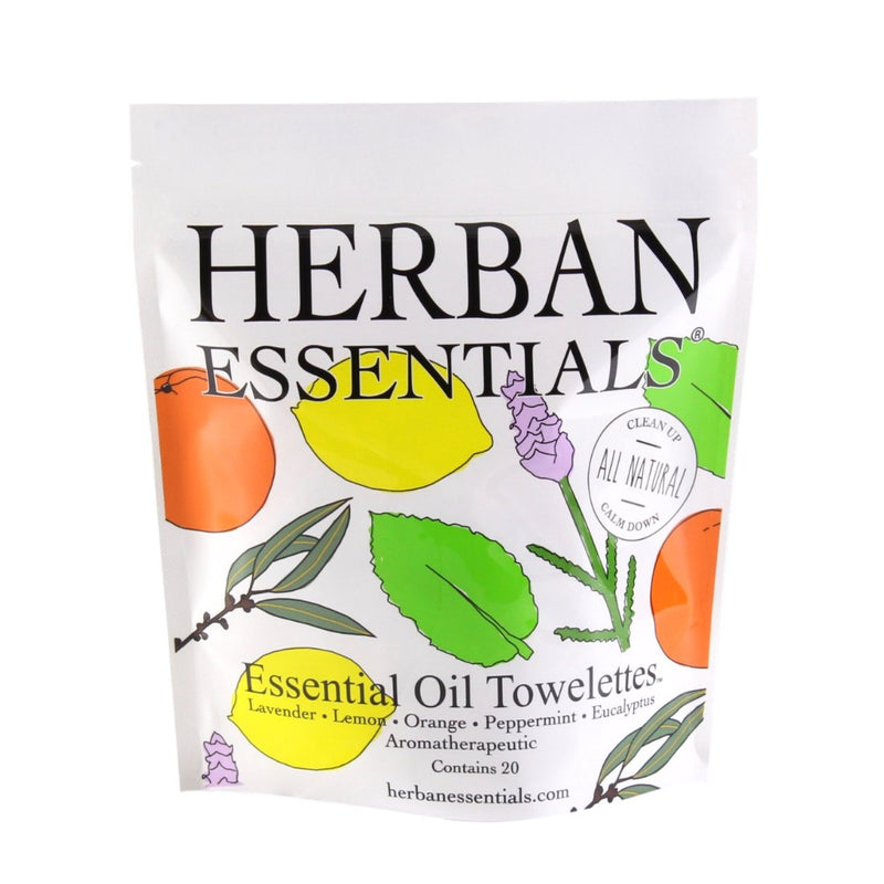 A Herban Essentials Essential Oil Towelettes - Mixed Bag package labeled "Herban Essentials" with illustrations of citrus fruits and leaves, advertising essential oil towelettes in various scents like lavender, lemon, orange, peppermint, and eucalyptus.