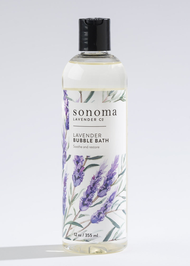 A bottle of Sonoma Lavender Bubble Bath, 12 oz (355 ml), with therapeutic-grade essential oils and illustrations of lavender sprigs on the label, against a light grey background.