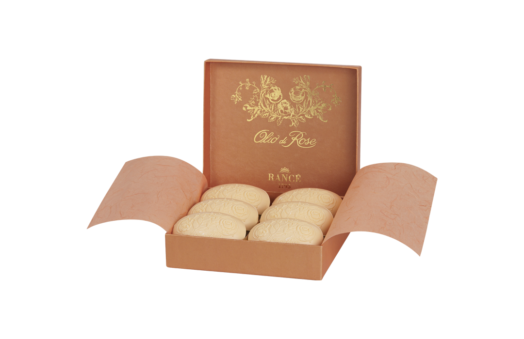 An elegant box of Rancé Classic Soap - Olio di Rose, featuring intricately embossed designs, presented in a luxurious open gift box with golden floral patterns.