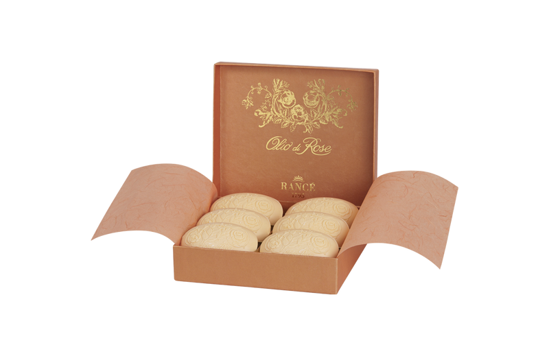 An elegant box of Rancé Classic Soap - Olio di Rose, featuring intricately embossed designs, presented in a luxurious open gift box with golden floral patterns.