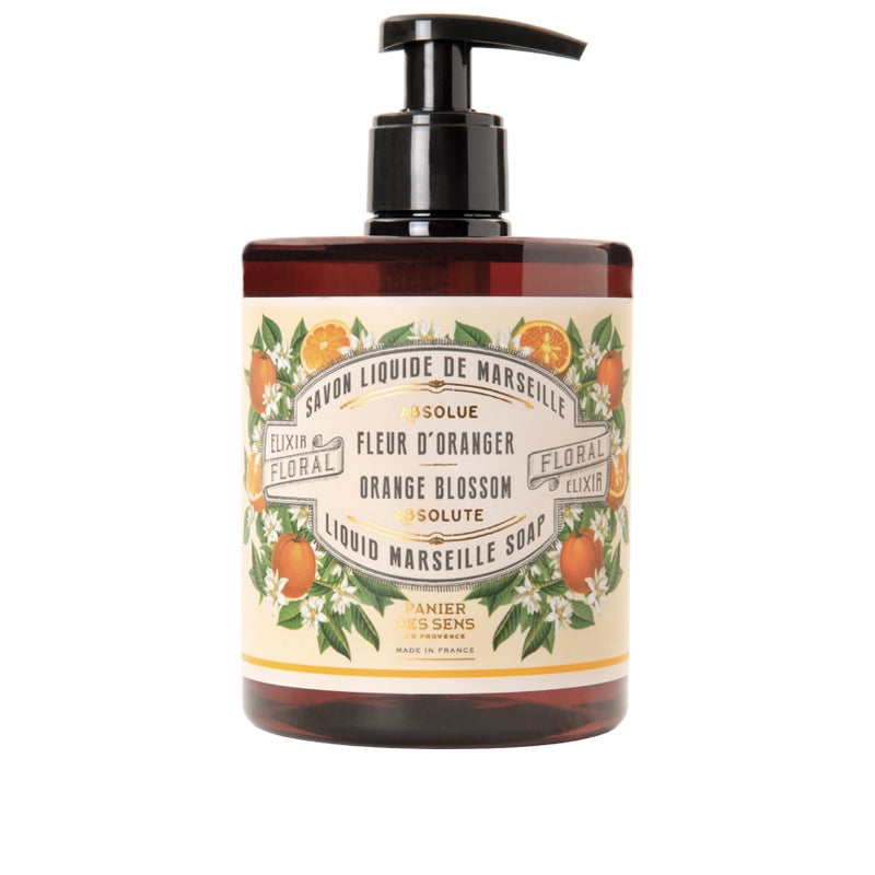 A pump bottle of Panier Des Sens Orange Blossom Liquid Marseille Soap labeled with orange blossom illustrations and olive oil text in French and English, isolated on a white background.