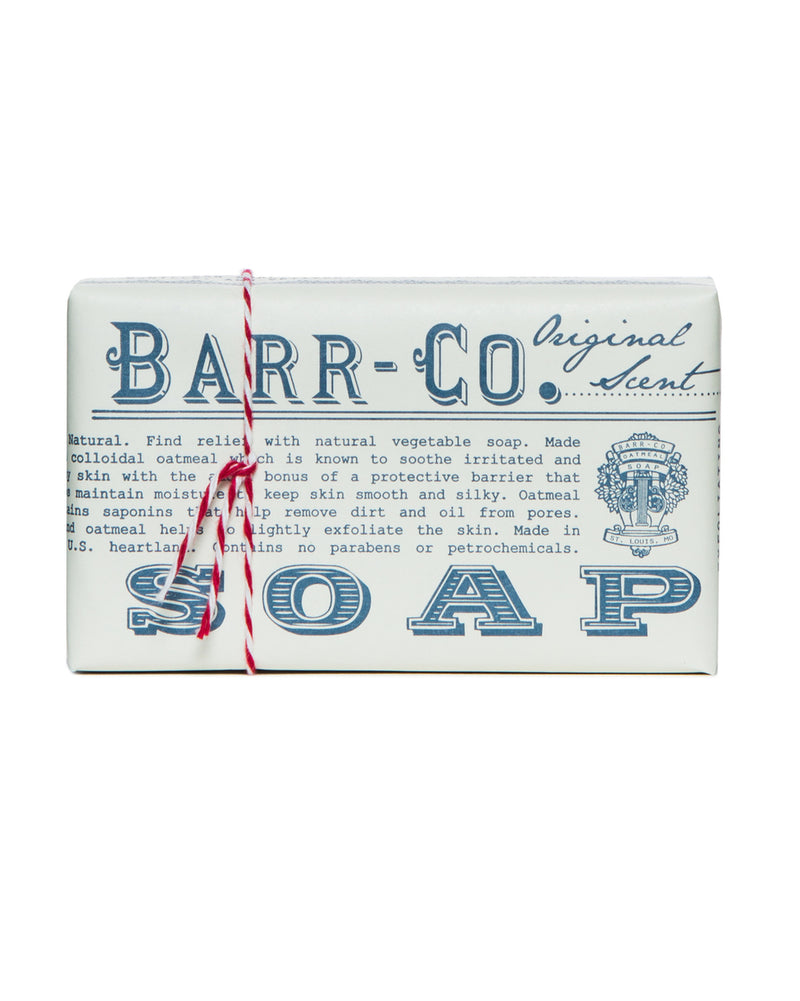 A bar of Barr-Co. Original Scent Triple-Milled Bar Soap with original scent packaging, featuring vintage-style blue text and graphics, tied with a red and white striped string.