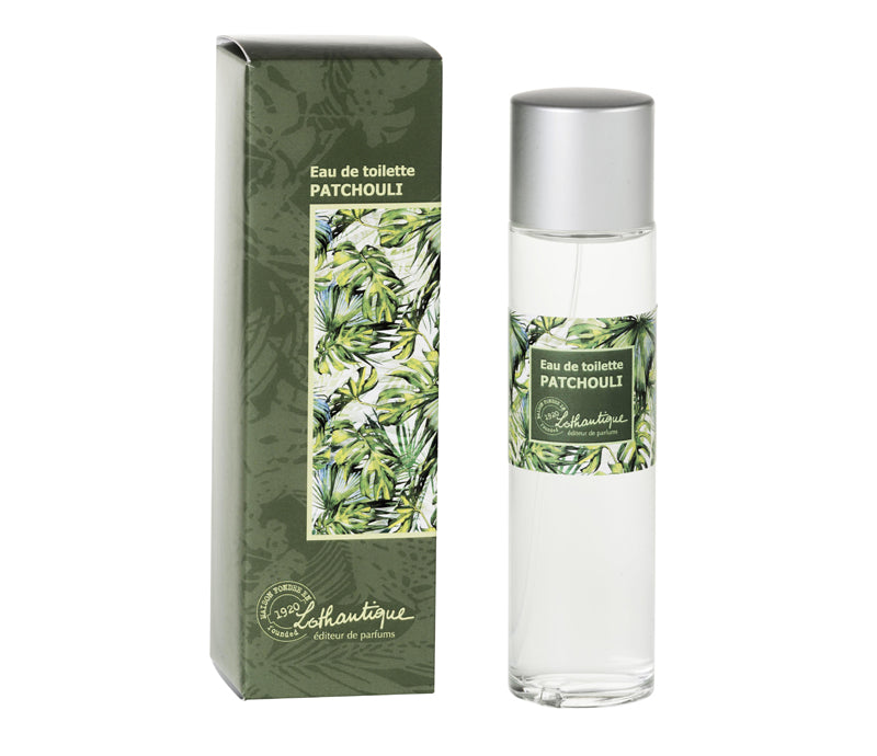 A bottle of Lothantique The Secrets of Josephine Patchouly Eau de Toilette next to its green packaging decorated with white floral illustrations. The bottle label repeats the design and text from the box.